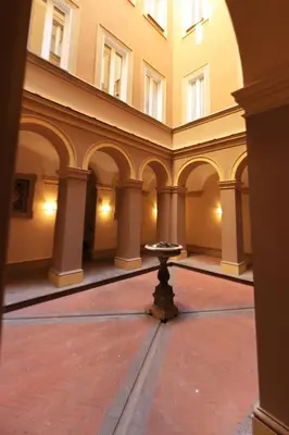 a room with a table in the middle of a building at Casa di Paolo a Fontana di Trevi in Rome