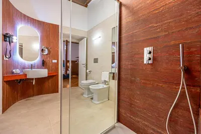 a bathroom with a shower and a toilet and a sink at AGH - Capranica in Rome