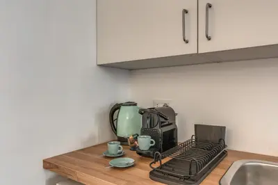a kitchen counter top with a toaster and coffee maker at Casa Belle Arti in Rome
