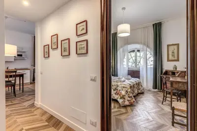 a room with a table and a dining room at Casa Belle Arti in Rome