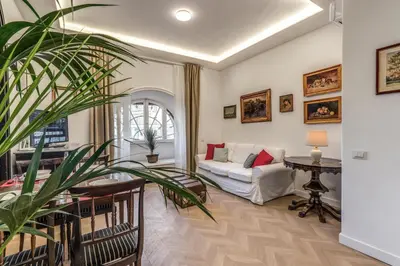 a living room with a couch and a table at Casa Belle Arti in Rome