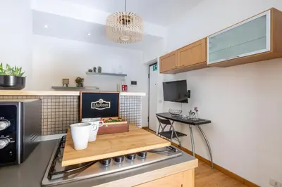 a kitchen with a stove and a counter top at Casa Girasole in Rome