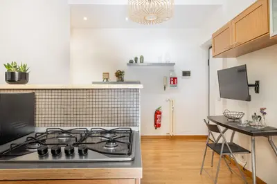 a kitchen with a stove and a counter top at Casa Girasole in Rome