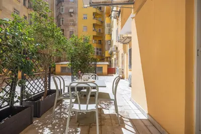 a table and chairs sitting on a balcony at Casa Girasole in Rome