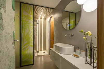 a bathroom with a sink and a mirror at Spagna Suite Luxury Home - Trevi Fountain in Rome