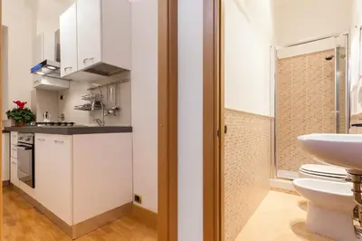 a small bathroom with a sink and a toilet at Vatican Loris House in Rome