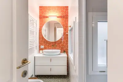 a bathroom with a sink and a mirror at Silent 2 Bdrm heart of Trastevere in Rome