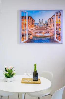 a painting of a city view from a window on a table at Luxury Suite-Metro Malatesta in Rome