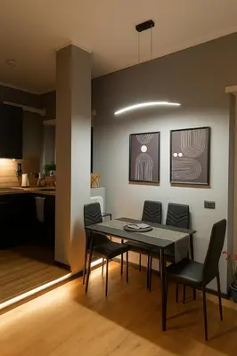 a dining room with a table and chairs at Trastevere Noir in Rome