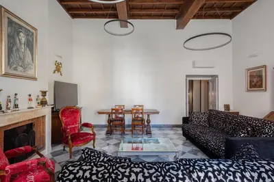 a living room with a couch and a table at Luxury apartment in Trastevere San Calisto in Rome