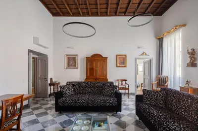 a living room with a couch and a table at Luxury apartment in Trastevere San Calisto in Rome