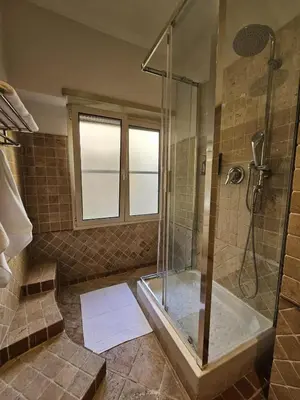 a bathroom with a shower and a bath tub at A Casa di Luca in Rome