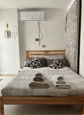 a bedroom with a bed with towels on it at La Casetta di Roma in Rome