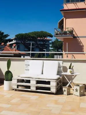 a white bed sitting on top of a building at La Casetta di Roma in Rome