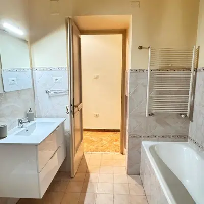 a bathroom with a tub and a sink and a shower at Angelico Home in Rome