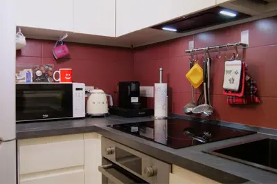 a kitchen with a sink and a microwave at Dimora Vantaggio in Rome
