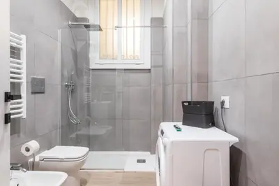 a bathroom with a toilet and a sink and a shower at C1 Top Class Apartments, 2 camere delux, max 6 persone distante 15 minuti a piedi da Fontana di Trevi in Rome