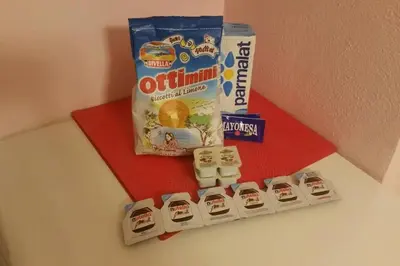a toy train and a pack of oreos and a packet of orange juice at Holiday Home Naiadis in Rome