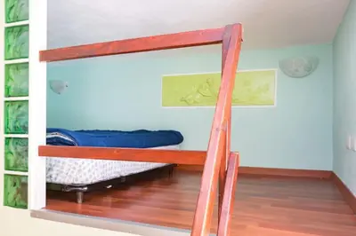 a bunk bed in a room with a ladder at Holiday Home Naiadis in Rome