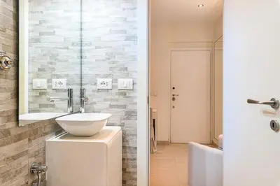 a bathroom with a sink and a mirror at Casa Tiburtina in Rome