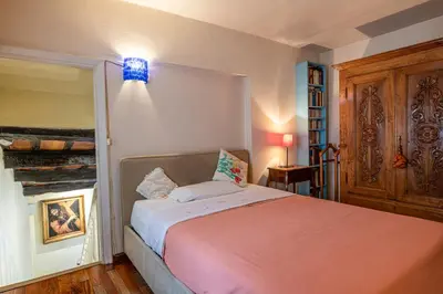 a bedroom with a large bed in a room at Rooma Duplex Campo de Fiori in Rome