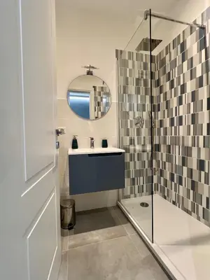 a bathroom with a sink and a shower at Alma Domus Feriae - Roma in Rome