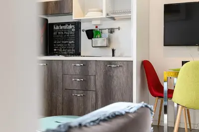 a kitchen with a counter and a table and chairs at Casa Vacanze Marrucini in Rome