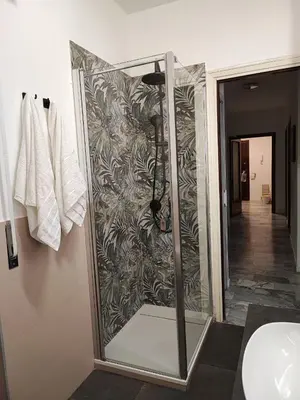 a shower with a glass door in a bathroom at Al Trilocale Romano Metro A in Rome