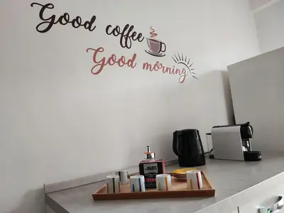 a kitchen with a coffee good morning wall sticker at Al Trilocale Romano Metro A in Rome