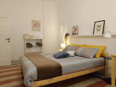 a bedroom with a large bed in a room at A casa di Gi in Rome