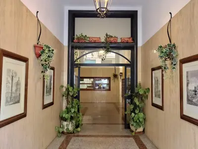 a hallway with plants on the walls at A casa di Gi in Rome