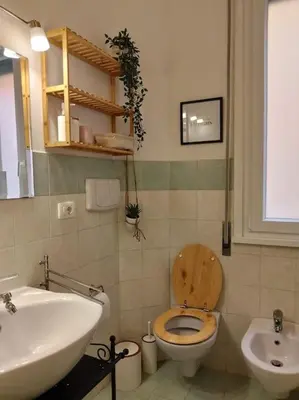 a bathroom with a toilet and a sink at A casa di Gi in Rome