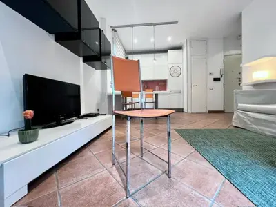 a bedroom with a bed with a blue and white blanket at Inn Trastevere Home in Rome