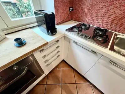 a kitchen with a counter top with a coffee maker at Inn Trastevere Home in Rome