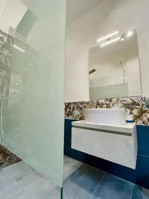 a bathroom with a sink and a mirror at Martina al Colosseo in Rome