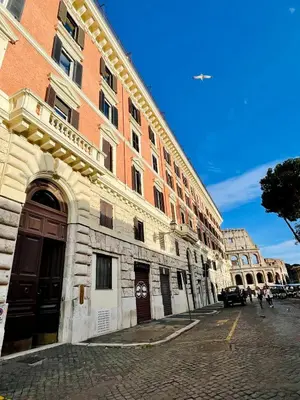 a large brick building on the side of a street at Martina al Colosseo in Rome