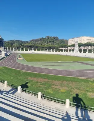 a group of shadows of people walking on a race track at Suite Guido Reni in Rome