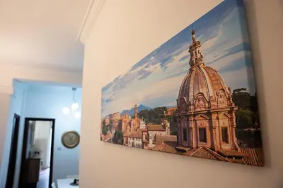 a picture of a building hanging on a wall at Optima mansio in Rome