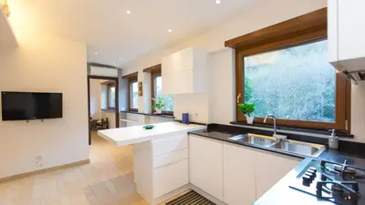 a kitchen with a sink and a large window at Panorama Penthouse by Rental in Rome in Rome