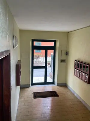 a building with a blue door and a fence at Fabio´s Holiday House in Rome