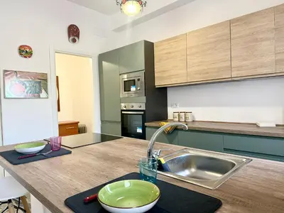 a kitchen with a sink and a counter top at Lungotevere Cozy Nest in Rome