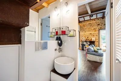 a bathroom with a white sink in a room at Loft in Garbatella in Garbatella