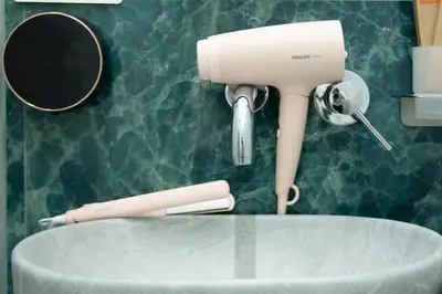 a hair dryer sitting on top of a table at New Luxury Rooms in Rome