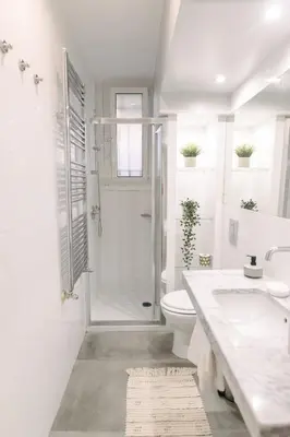 a bathroom with a shower and a toilet and a sink at Atella Rome Apartment in Rome