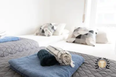 a stuffed animal on a blue towel on a bed at Domus Trionfale - 8 min walk to Vatican, 500mt to Metro A, A-C in Rome