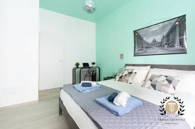 a bedroom with a bed with towels on it at Domus Trionfale - 8 min walk to Vatican, 500mt to Metro A, A-C in Rome