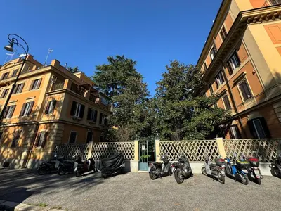 a group of motorcycles parked in front of a fence at Green Oasis in Villa Riccio in Rome