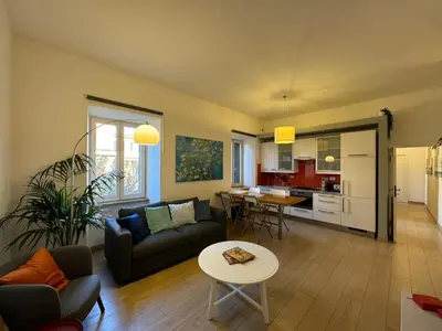 a living room with a couch and a table at Green Oasis in Villa Riccio in Rome