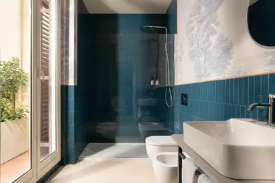 a bathroom with a toilet and a sink at Cloud 7 Roma Hotel in Rome