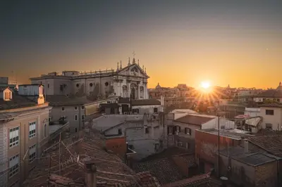 a view of the city at sunset at Cloud 7 Roma Hotel in Rome